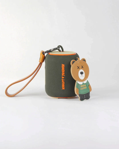 Olive green Belleville Bluetooth speaker featuring a streetwear-style bear accessory and Marceau & Luthier branding.