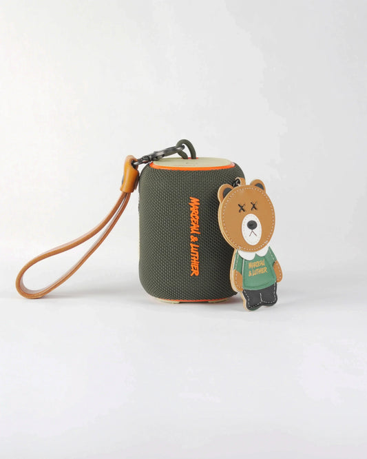 Olive green Belleville Bluetooth speaker featuring a streetwear-style bear accessory and Marceau & Luthier branding.