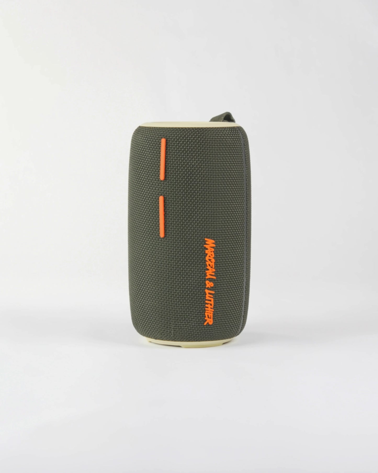 Close-up of the bold orange plus and minus volume buttons on the Pigalle speaker's minimalist interface.