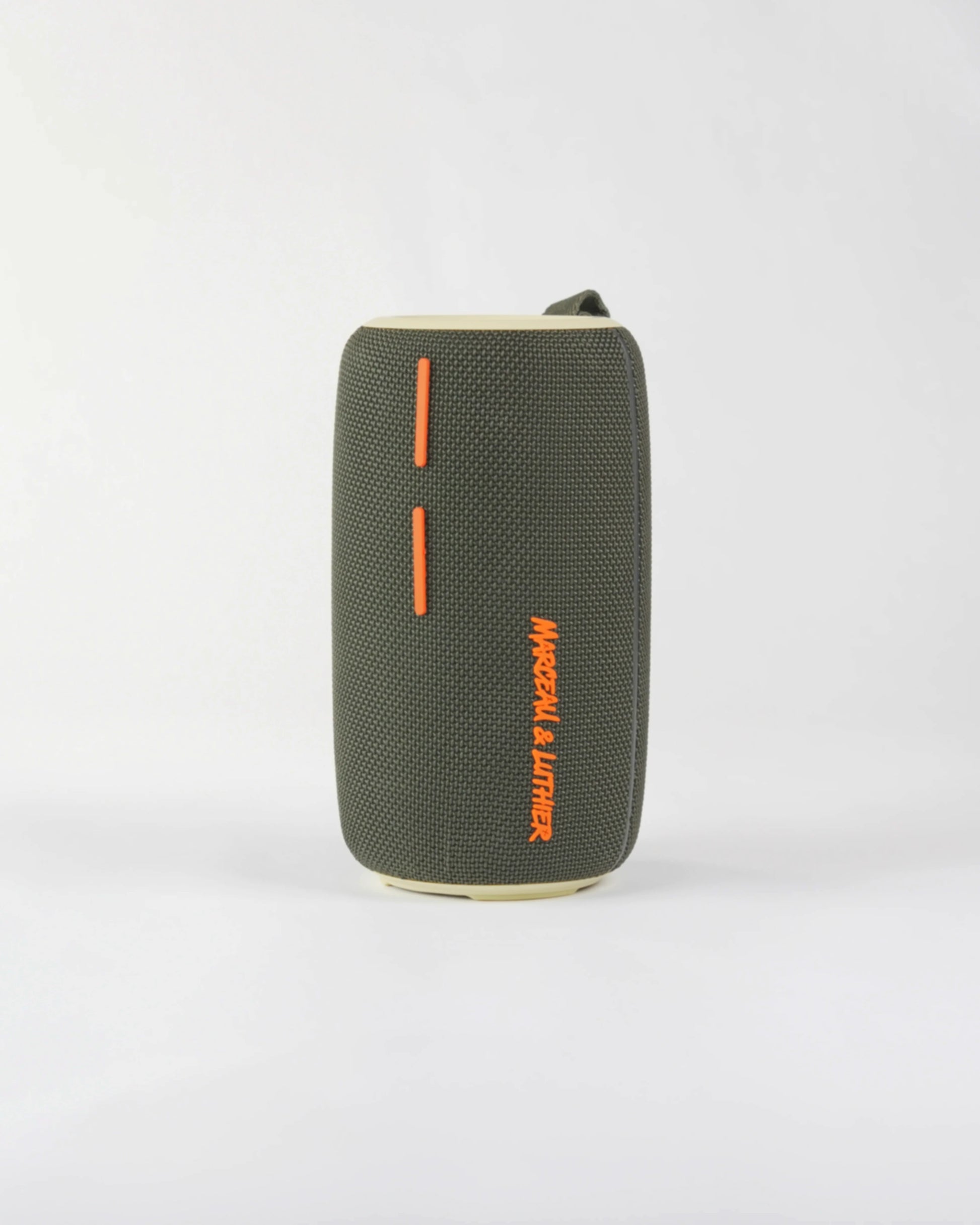 Close-up of the bold orange plus and minus volume buttons on the Pigalle speaker's minimalist interface.
