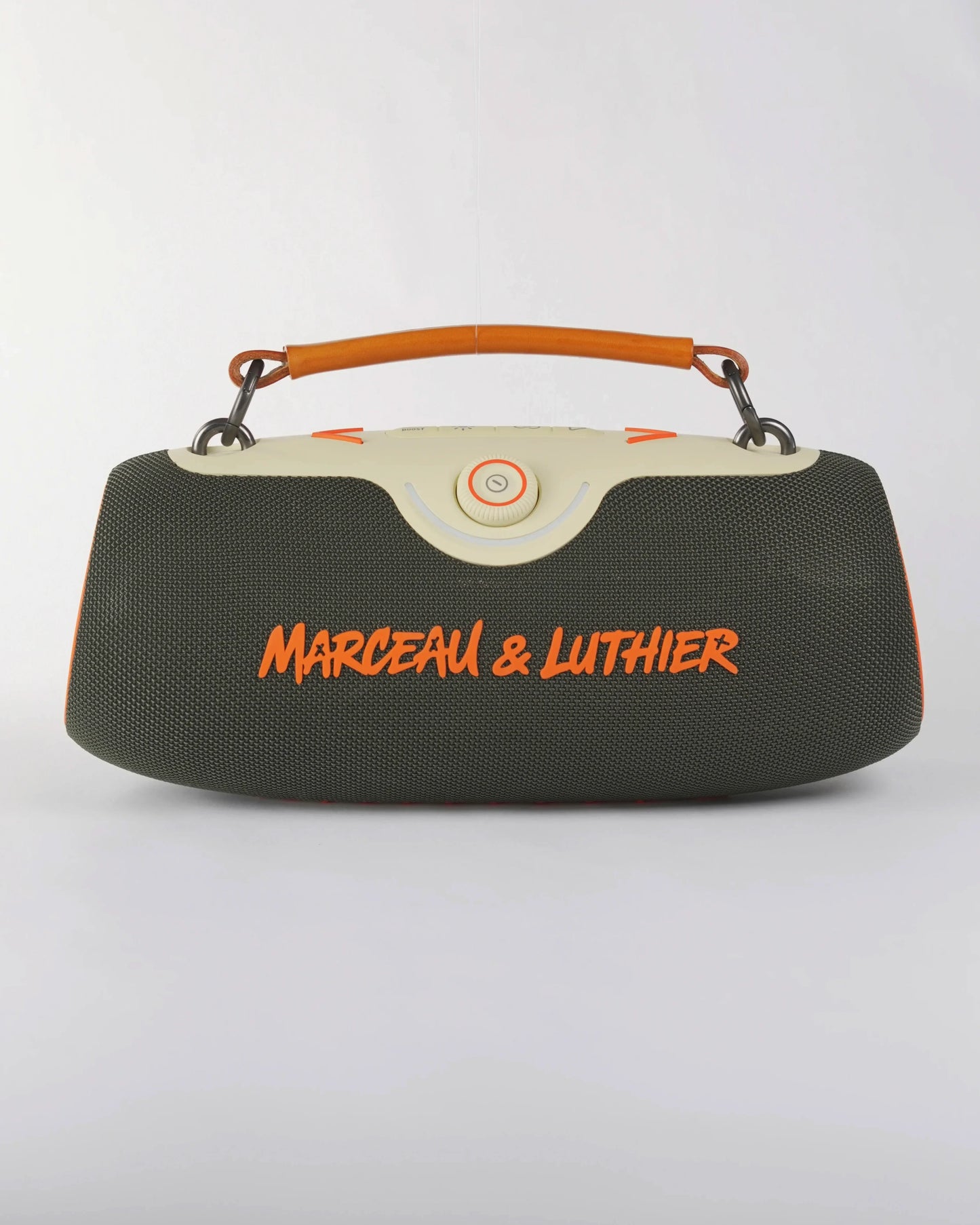 Front view of the Rive Droite speaker in dark green fabric with the signature orange Marceau & Luthier logo.